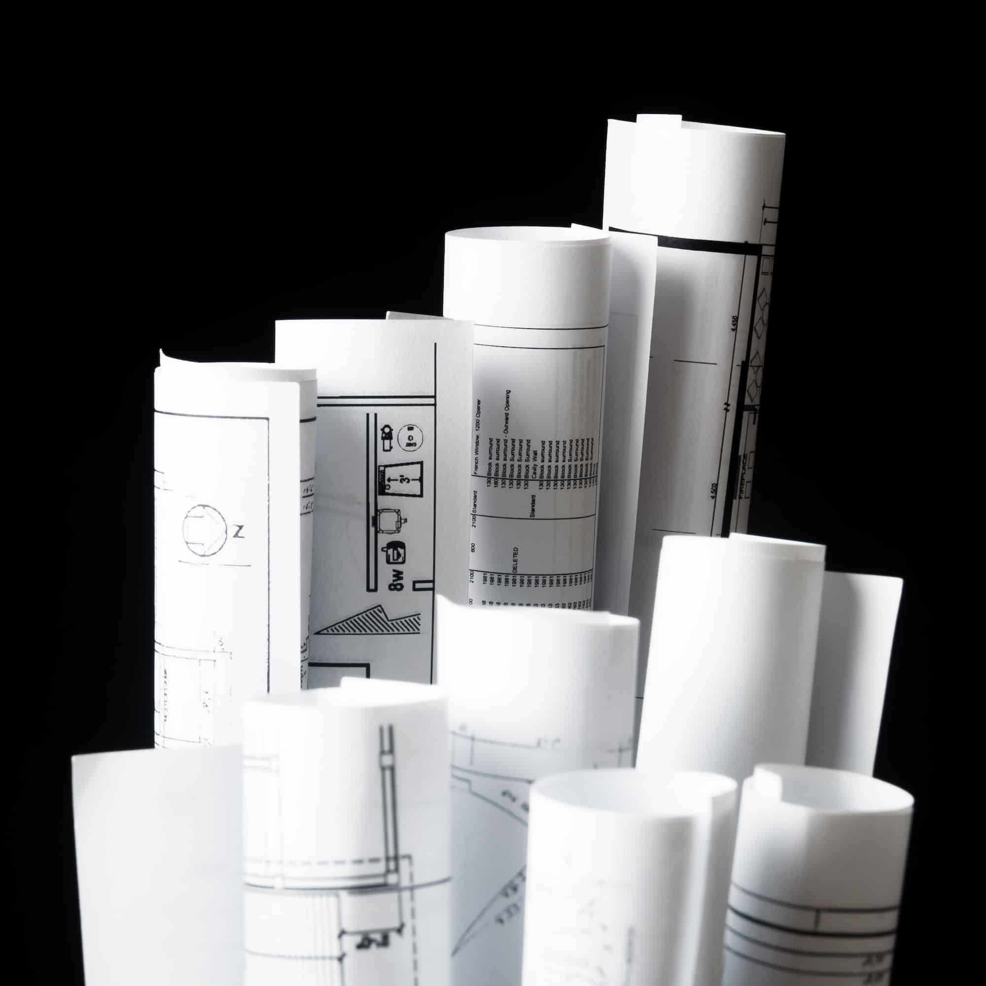 rolls of architecture blueprints and house plans